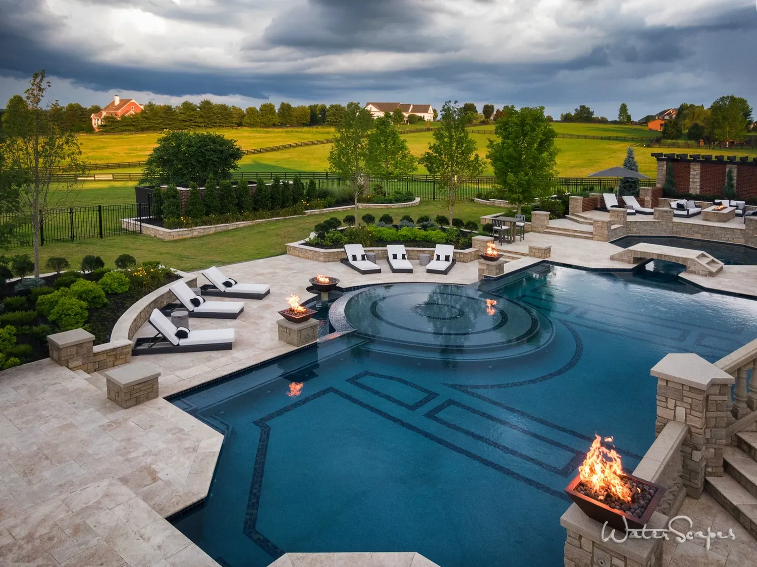 Luxury resort-style gunite pool with cascading water feature built by Waterscapes Backyard Resorts in Nashville Tennessee
