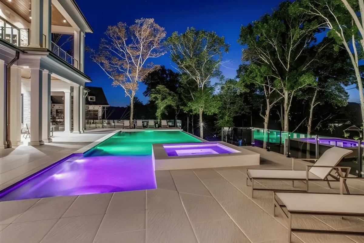 Custom gunite pool with LED lighting at night built by Waterscapes Backyard Resorts in Middle Tennessee