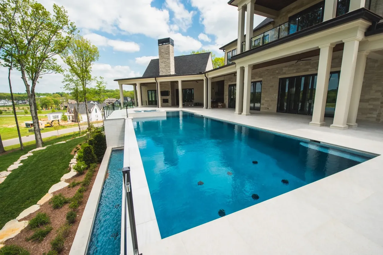 Custom gunite pool with tanning ledge built by Waterscapes Backyard Resorts in Nashville Tennessee